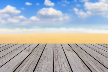 wood floor with blur beach and sea background
