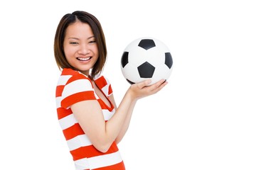 Young woman holding football