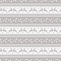 Christmas seamless pattern with deer and holly.