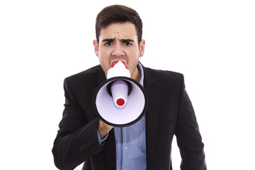 Young man shouting with the megafono isolated on white
