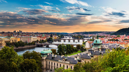 Naklejka premium Evening sunset Panorama of Prague with Vltava river and Prague Bridges, high resolution image.