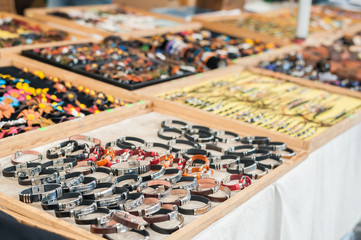 Selective focus on leather bracelets. Jewellery display stand.