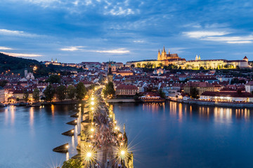 Pargue at dusk, view of the Lesser Bridge Tower of Charles Bridge (Karluv Most) and Prague Castle, Czech Republic.