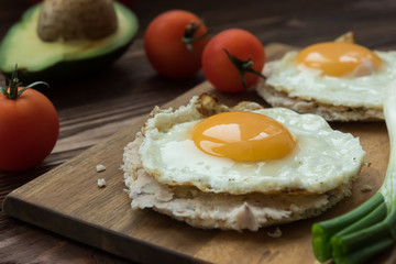 Huevos rancheros tostadas with avocado salsa