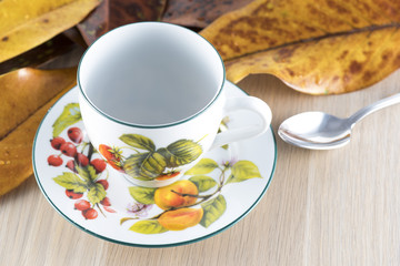 Tea cup and Magnolia Grandiflora leaf