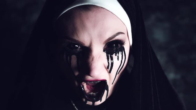 4k Halloween Shot of a Horror Woman Screaming with Blackout Eyes
