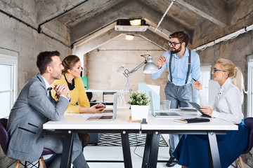 Creative business people brainstorming at modern office