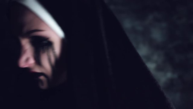 4k Halloween Shot of a Horror Woman turning and Screaming with blackout Eyes
