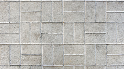 Concrete or cobble gray pavement slabs or stones.