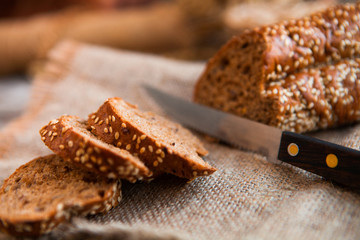Sliced rye bread on a Board. On a wooden rustic table.