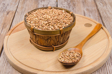 wooden bowl with buckwheat