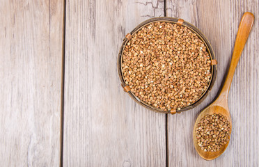 wooden bowl with buckwheat