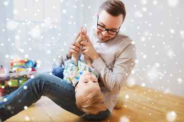 father with son playing and having fun at home