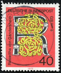 stamp printed in Germany issued for the 1000th death anniversary of Roswitha von Gandersheim (poetess) shows a motif with letter R