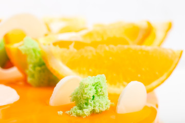 Kiwi siphon sponge on orange glazed cake.