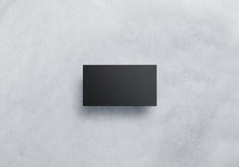 Blank black visit card design mockup, grey craft paper. Plain dark business namecard presentation.