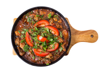 Delicious stewed pork fillet with fresh tomatoes.