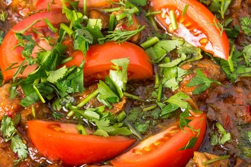 Delicious stewed pork fillet with fresh tomatoes.