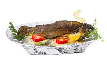 Delicious grilled trout with vegetables.