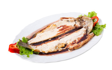 Grilled trout fillet with fresh vegetables.