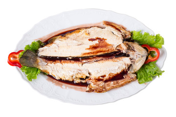 Grilled trout fillet with fresh vegetables.