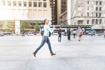 Panning view of a woman running in the city