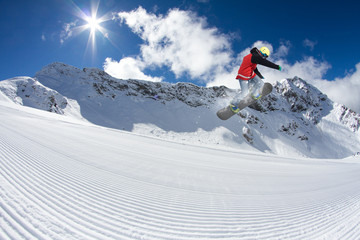 Snowboard rider jumping on mountains. Extreme snowboard freeride sport. © Vasily Merkushev