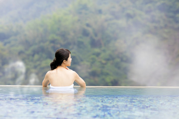 young woman relaxing in  hot springs