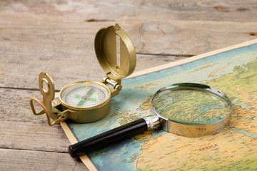compass and vintage map on the wooden desk