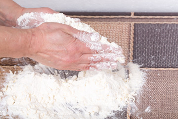 Obraz premium Male hands making dough.