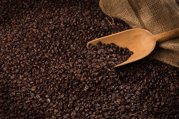 Coffee beans fullsscreen with serving spoon and burlap sac