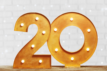 Big plastic numbers with shining light bulbs