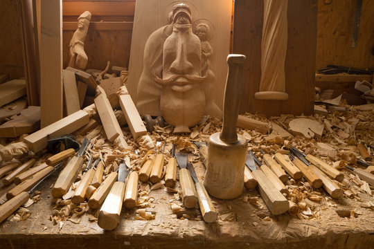 Wooden carnival mask and tools in carpentry  workshop