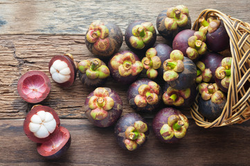 Mangosteen fruit on wood table with top view - 128474943