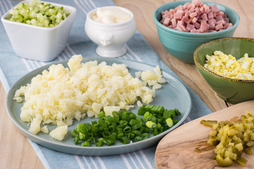 Ingredients for traditional russian olivier salad with ham veget