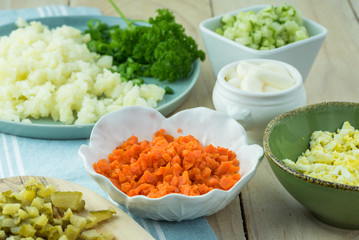 Ingredients for traditional russian olivier salad with ham veget