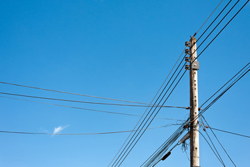 Power lines and insulators with blue sky