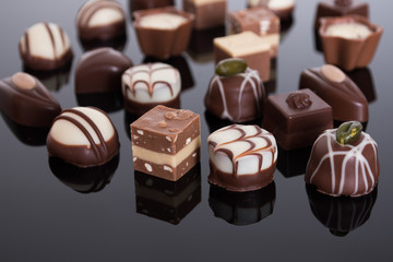 An assortment of fine chocolates in white, dark, and milk chocol