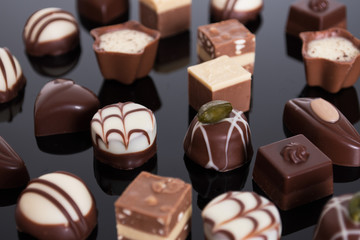 An assortment of fine chocolates in white, dark, and milk chocol