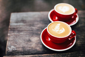 Two cups of cappuccino with latte art