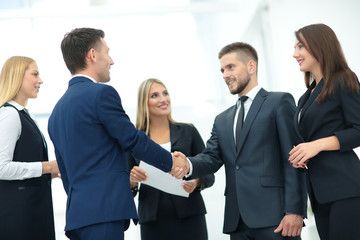Business partner greeting each other with handshake