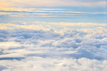 Fototapeta na wymiar Clouds and Sky as seen through Window of an Aircraft, Horizontal View