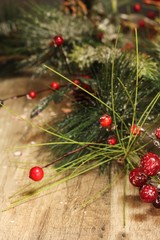 Christmas background with holiday garland on wooden board, selective focus