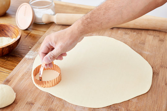 Making mezzelune handmade pasta