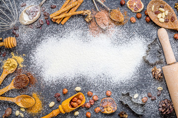 Christmas Background with Spices, Nuts, Rosines, Ginger, Cocoa Powder, Dried Oranges on Dark Stone Background with Free Space for You Christmas Text, Christmas Wallpaper