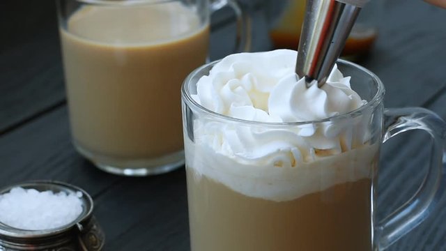 Caramel latte with whipped cream and salt