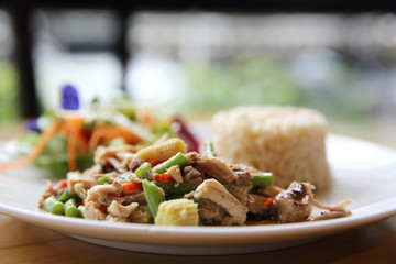 Stir fried chicken and basil served with rice