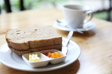 Fototapeta na wymiar Slice bread with orange jam