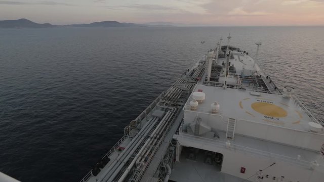 Gas tanker at sea in sunset top view