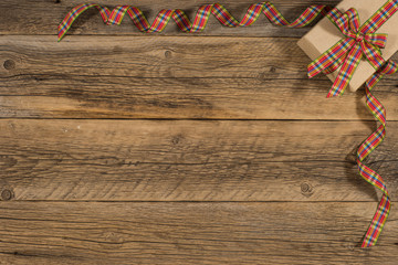 Fototapeta premium Gift box on an old wooden table.